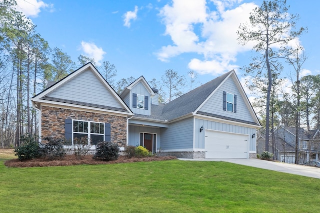 view of front of property featuring driveway, stone siding, a front yard, board and batten siding, and brick siding