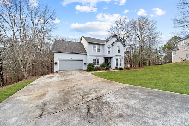 view of front of home with a front lawn and a garage