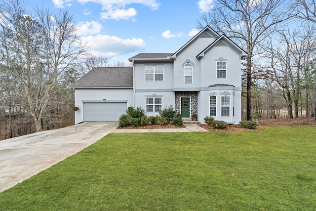 front facade featuring a garage and a front yard