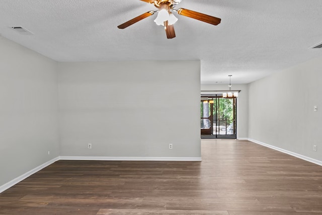 108 Ashwood Pt, Eatonton, GA 31024 - unfurnished room with a textured ceiling, wood finished floors, baseboards, a ceiling fan, and a chandelier