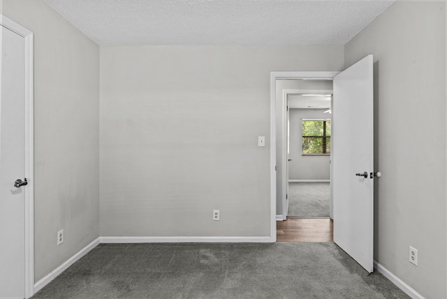 108 Ashwood Pt, Eatonton, GA 31024 - carpeted spare room with baseboards and a textured ceiling