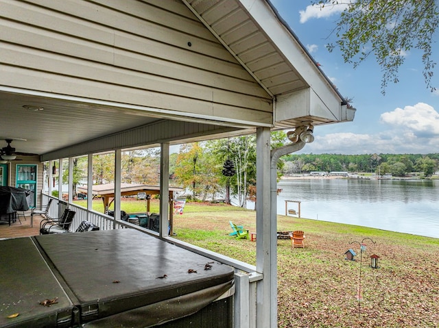 exterior space with a lawn and a water view