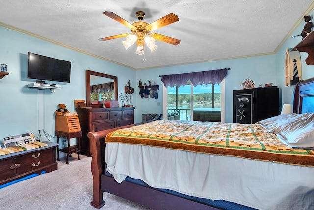 carpeted bedroom with ceiling fan, access to exterior, ornamental molding, and a textured ceiling