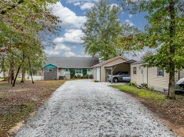 single story home featuring a carport