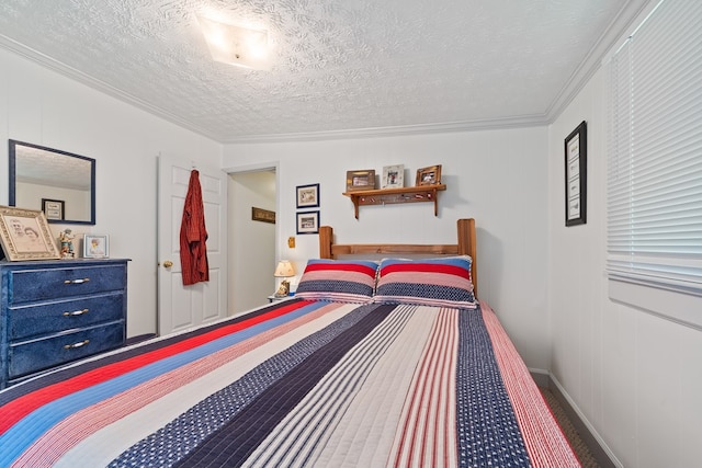 bedroom featuring carpet, a textured ceiling, and ornamental molding