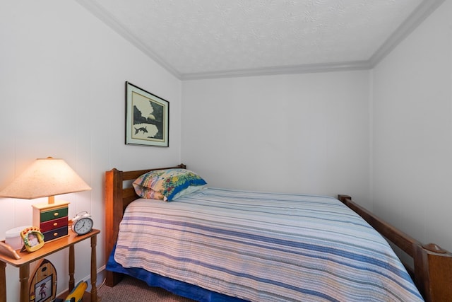 bedroom with crown molding and a textured ceiling