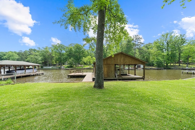 dock featuring a lawn, a water view, and boat lift