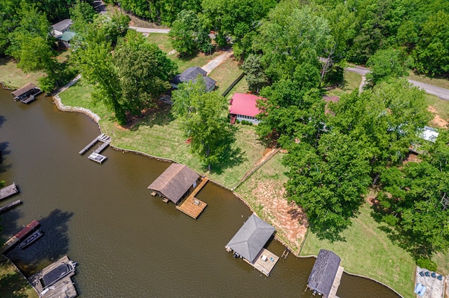 aerial view of property and surrounding area featuring a large body of water