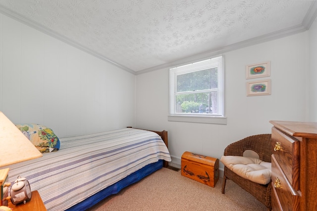 bedroom featuring ornamental molding, a textured ceiling, and carpet flooring
