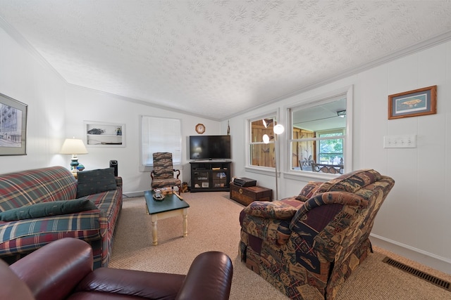 living area featuring a textured ceiling, lofted ceiling, carpet flooring, crown molding, and baseboards