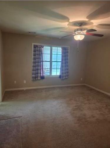 179 Garrett Dr, Eatonton, GA 31024 - carpeted empty room with baseboards and a ceiling fan