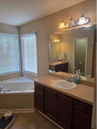 179 Garrett Dr, Eatonton, GA 31024 - bathroom featuring vanity and a garden tub