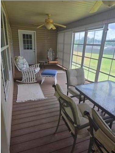 179 Garrett Dr, Eatonton, GA 31024 - sunroom / solarium with a ceiling fan, plenty of natural light, and outdoor dining area