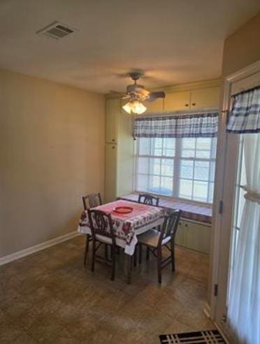 179 Garrett Dr, Eatonton, GA 31024 - dining space featuring a ceiling fan and baseboards