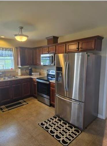 179 Garrett Dr, Eatonton, GA 31024 - kitchen with stainless steel appliances and light countertops