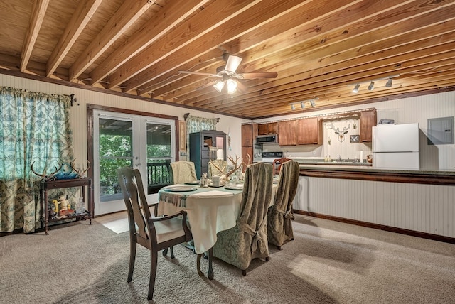 dining area with electric panel, light colored carpet, a ceiling fan, and french doors