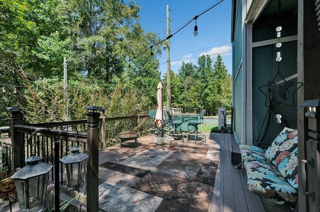 wooden terrace with outdoor dining space