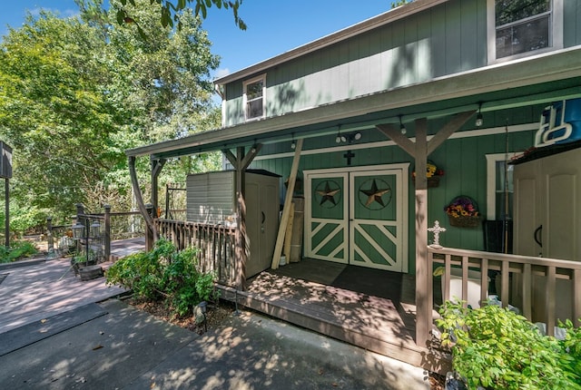 entrance to property with a wooden deck