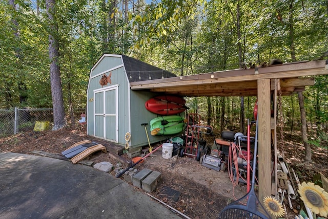 view of shed with fence