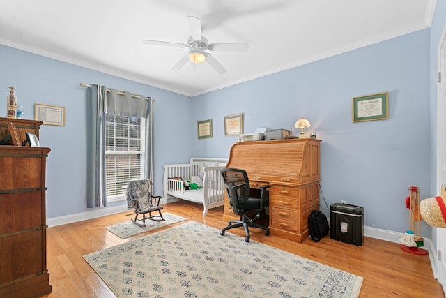 office with ornamental molding, light wood-type flooring, ceiling fan, and baseboards