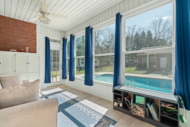 sunroom with a ceiling fan