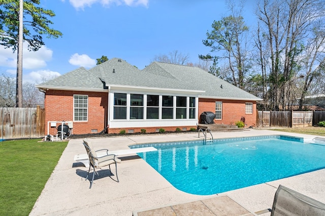 view of swimming pool with a fenced in pool, a patio, a fenced backyard, a grill, and a yard