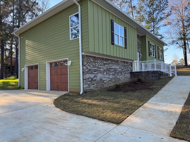 view of side of property with a garage