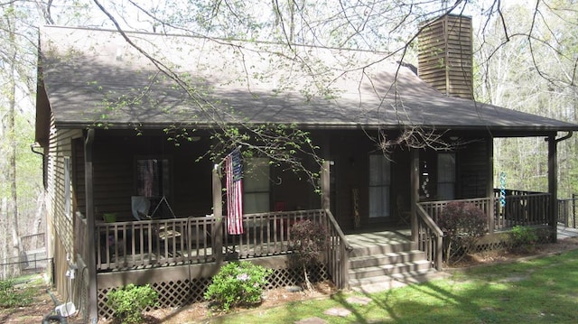 102 Treanor Dr, Milledgeville, GA 31061 - view of front of home featuring a chimney and covered porch