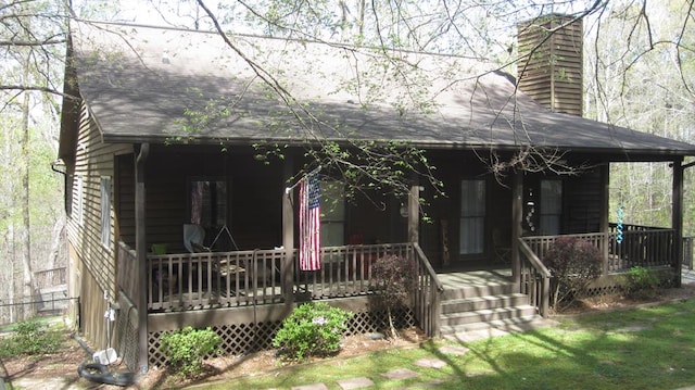 102 Treanor Dr, Milledgeville, GA 31061 - view of front of house with a chimney and covered porch