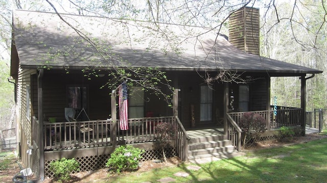 102 Treanor Dr, Milledgeville, GA 31061 - view of front facade with a chimney and a porch