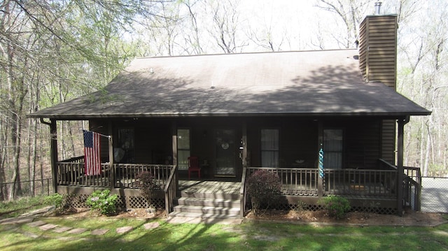 102 Treanor Dr, Milledgeville, GA 31061 - view of front facade featuring covered porch and a chimney