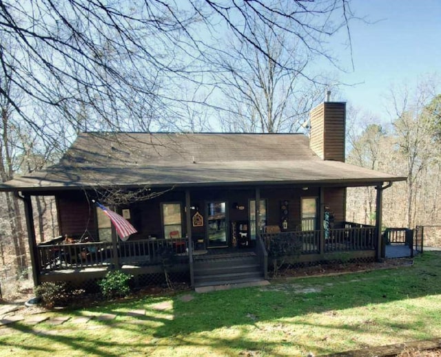 102 Treanor Dr, Milledgeville, GA 31061 - rear view of house with a lawn, a chimney, and covered porch