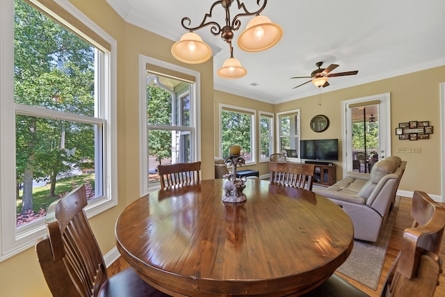 128A Montego Bay Rd, Milledgeville, GA 31061 - dining space featuring baseboards, wood finished floors, crown molding, and a ceiling fan