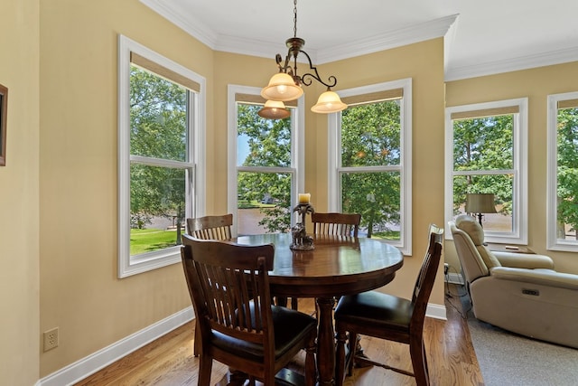 128A Montego Bay Rd, Milledgeville, GA 31061 - dining area with light wood finished floors, baseboards, and ornamental molding