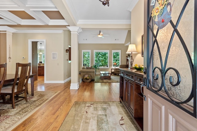 128A Montego Bay Rd, Milledgeville, GA 31061 - entrance foyer with ornate columns, a ceiling fan, crown molding, light wood-type flooring, and baseboards