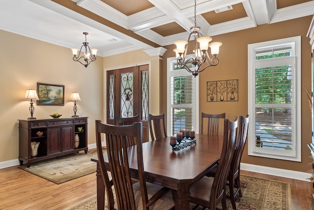 128A Montego Bay Rd, Milledgeville, GA 31061 - dining area featuring a chandelier, ornamental molding, light wood-type flooring, baseboards, and beamed ceiling