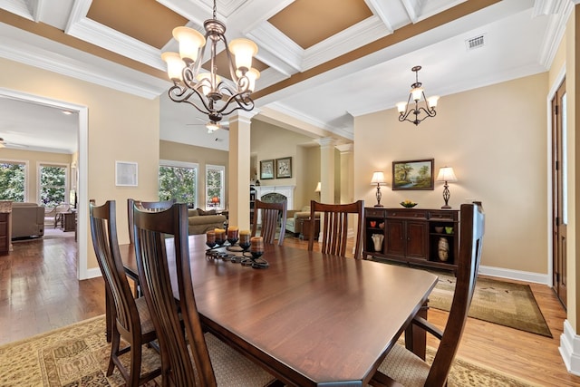 128A Montego Bay Rd, Milledgeville, GA 31061 - dining space with a chandelier, healthy amount of natural light, light wood-style flooring, crown molding, and beam ceiling