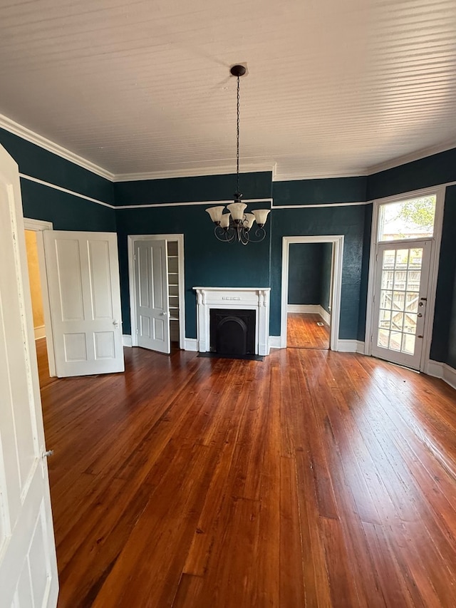 120 Franklin St, Milledgeville, GA 31061 - unfurnished living room with a chandelier, hardwood / wood-style flooring, ornamental molding, and baseboards