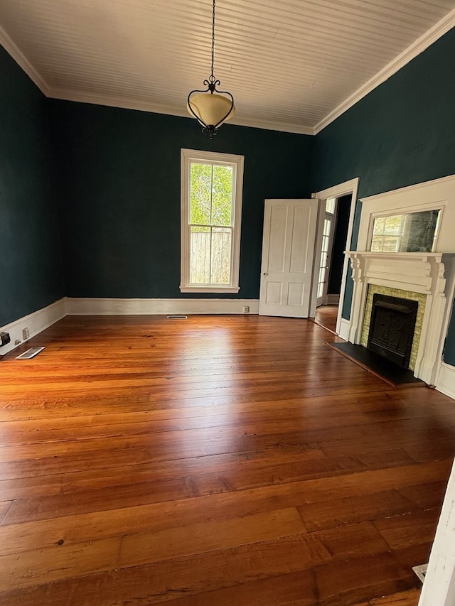 120 Franklin St, Milledgeville, GA 31061 - unfurnished living room with hardwood / wood-style floors, a fireplace, crown molding, and baseboards