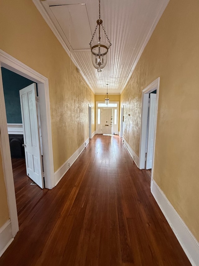 120 Franklin St, Milledgeville, GA 31061 - hallway with ornamental molding, attic access, dark wood-type flooring, baseboards, and a chandelier