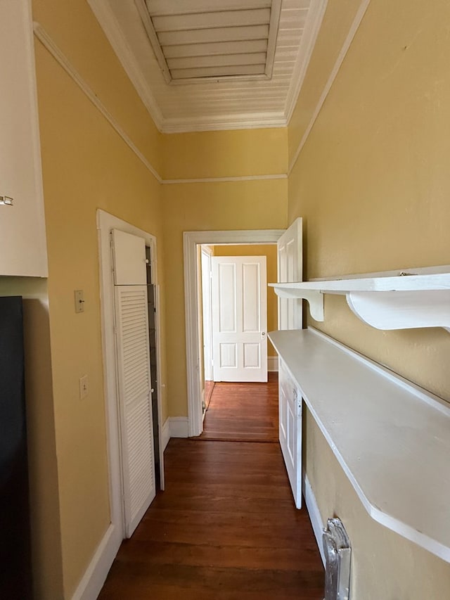 120 Franklin St, Milledgeville, GA 31061 - hallway featuring dark wood-type flooring, crown molding, radiator heating unit, and baseboards