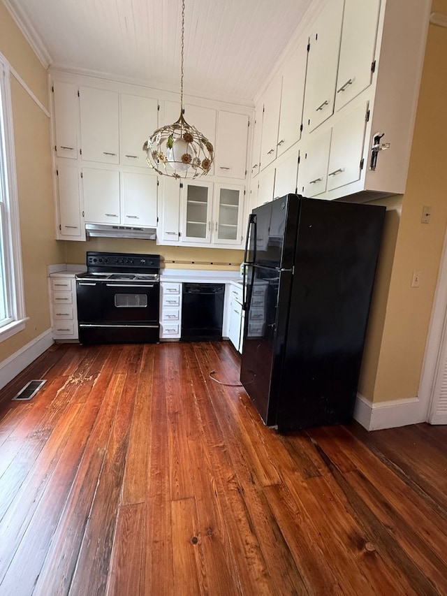 120 Franklin St, Milledgeville, GA 31061 - kitchen featuring black appliances, under cabinet range hood, and dark wood-style floors