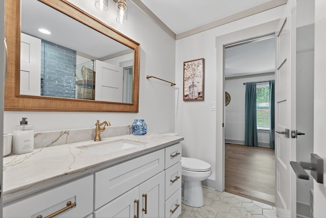 517 Hill Valley Rd, Sparta, GA 31087 - full bathroom featuring vanity, toilet, tiled shower, ornamental molding, and recessed lighting