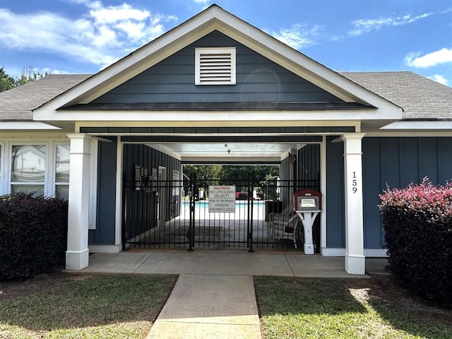 110 Colin Ln, Eatonton, GA 31024 - property entrance featuring roof with shingles and board and batten siding