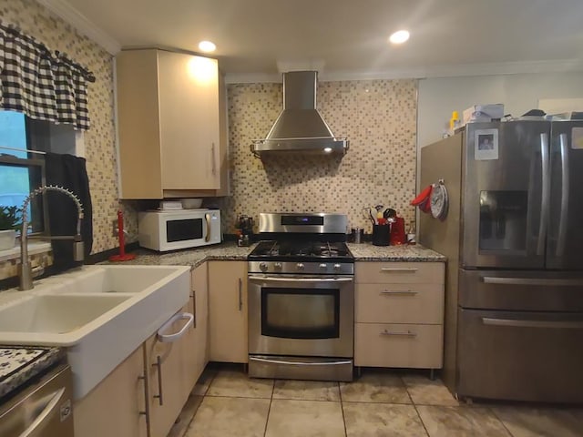 1745 Cedarwood Dr, Milledgeville, GA 31061 - kitchen featuring stainless steel appliances, wall chimney range hood, ornamental molding, a sink, and tasteful backsplash