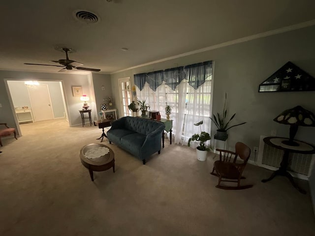 1745 Cedarwood Dr, Milledgeville, GA 31061 - carpeted living area featuring crown molding and ceiling fan