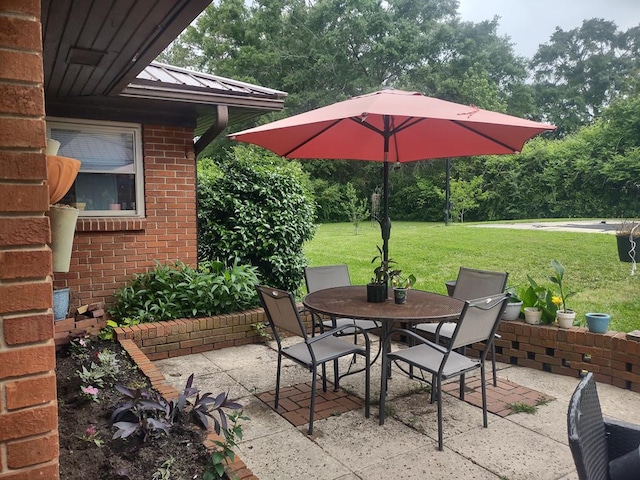 1745 Cedarwood Dr, Milledgeville, GA 31061 - view of patio / terrace with outdoor dining space and view of scattered trees