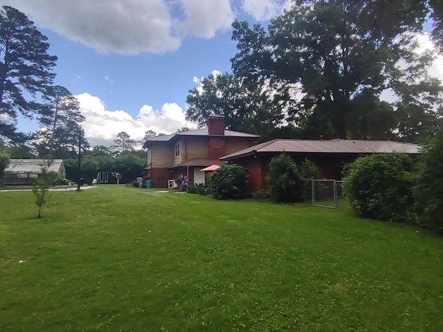 1745 Cedarwood Dr, Milledgeville, GA 31061 - view of green lawn with a gate