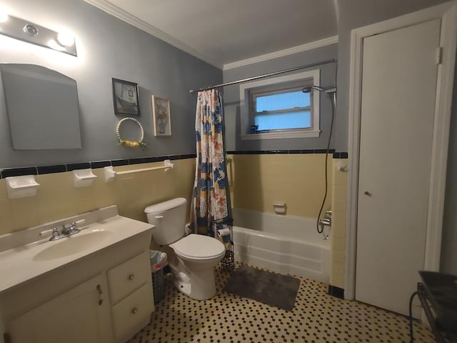 1745 Cedarwood Dr, Milledgeville, GA 31061 - bathroom with ornamental molding, toilet, tile walls, shower / bathtub combination with curtain, and vanity