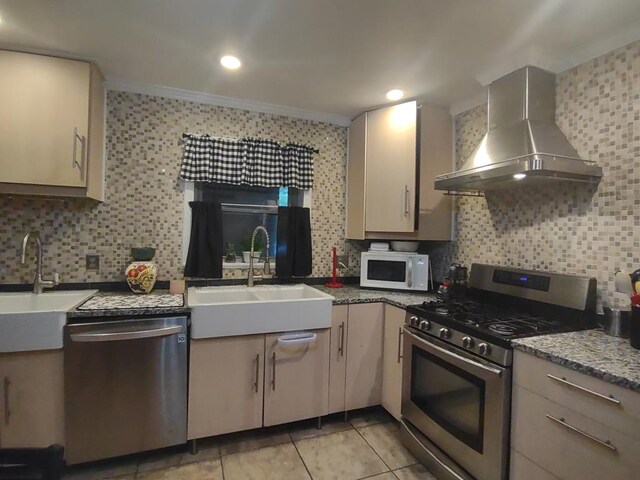 1745 Cedarwood Dr, Milledgeville, GA 31061 - kitchen with stainless steel appliances, wall chimney exhaust hood, a sink, decorative backsplash, and crown molding